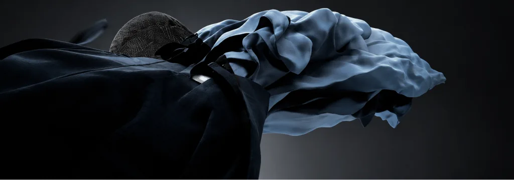 Blue 50GSM fabric flowing over a dark jacket