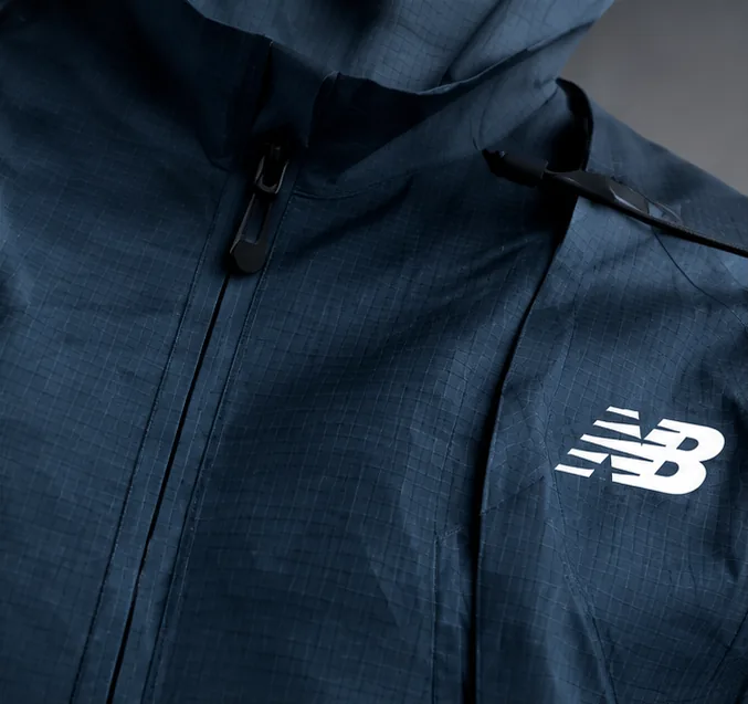 Close up of the zip, shoulder strap and chest logo